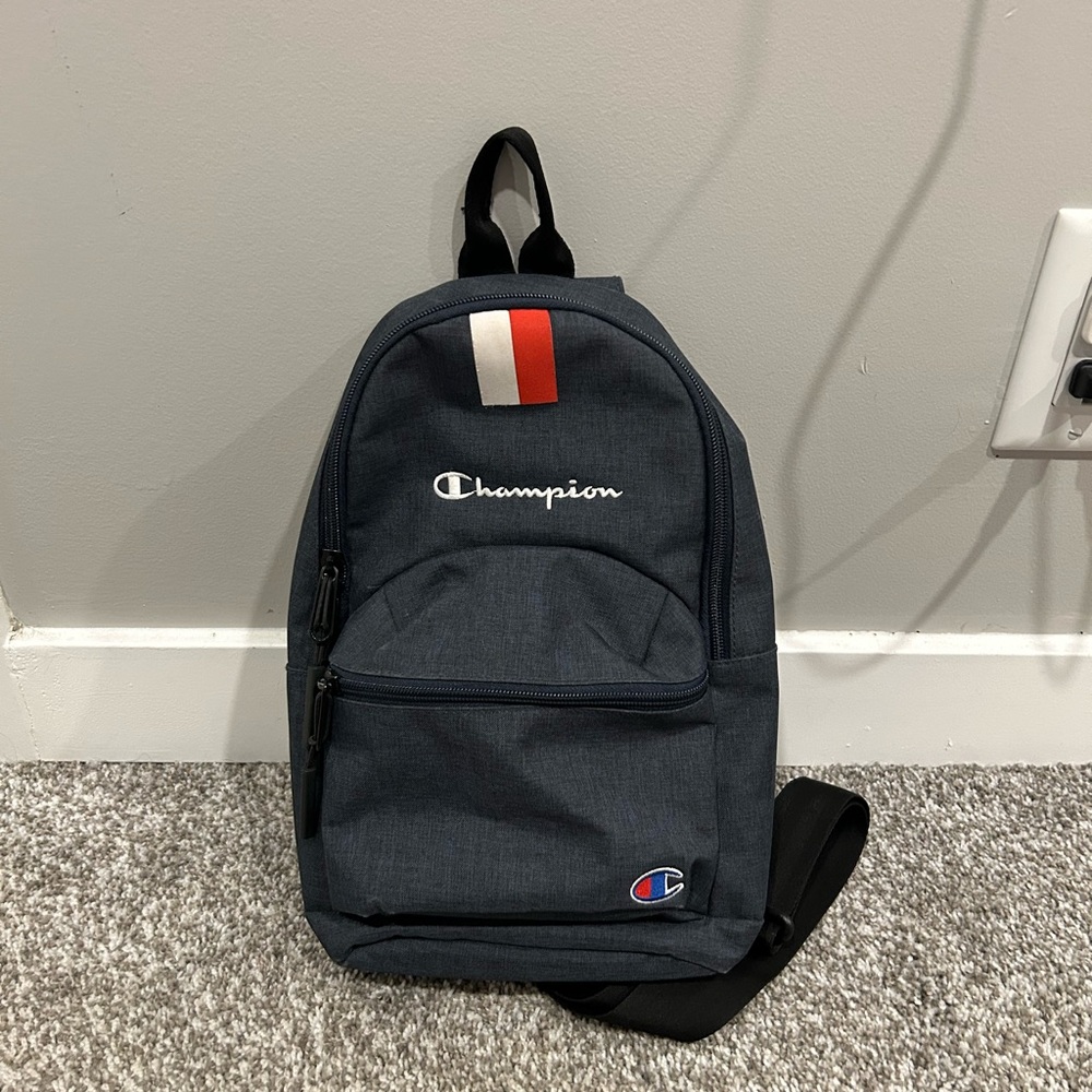 Champion Dark Blue Backpack with Red and White Accents